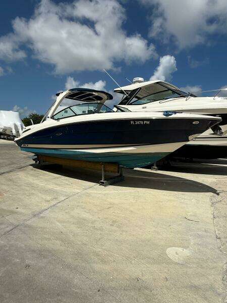 2014 Sea Ray 270 SLX boat on a sunny day at a marina.