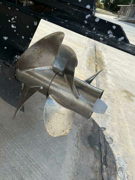 Propeller of 2014 Sea Ray 270 SLX boat on concrete surface.