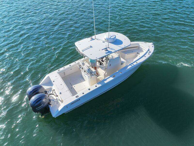 2018 Jupiter 26 FS boat on water, aerial view, twin engines, white hull.