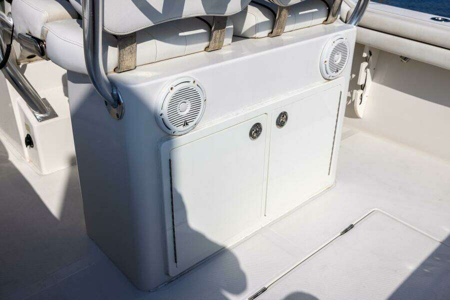 2018 Jupiter 26 FS boat interior with white seating and built-in speakers.