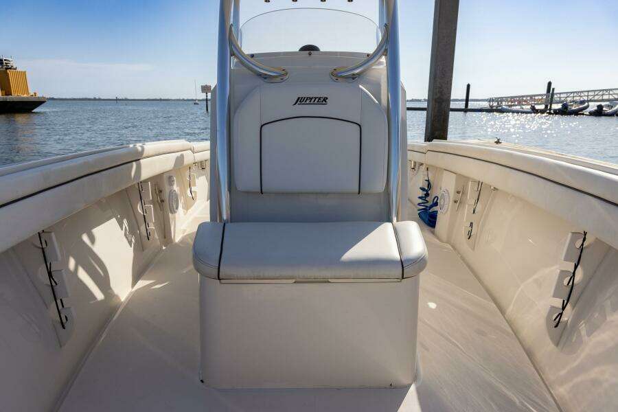 2018 Jupiter 26 FS boat interior with seating, docked by the water.