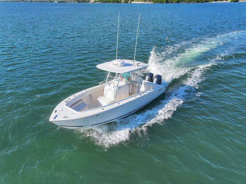 2018 Jupiter 26 FS boat cruising on open water, showcasing sleek design and powerful engines.