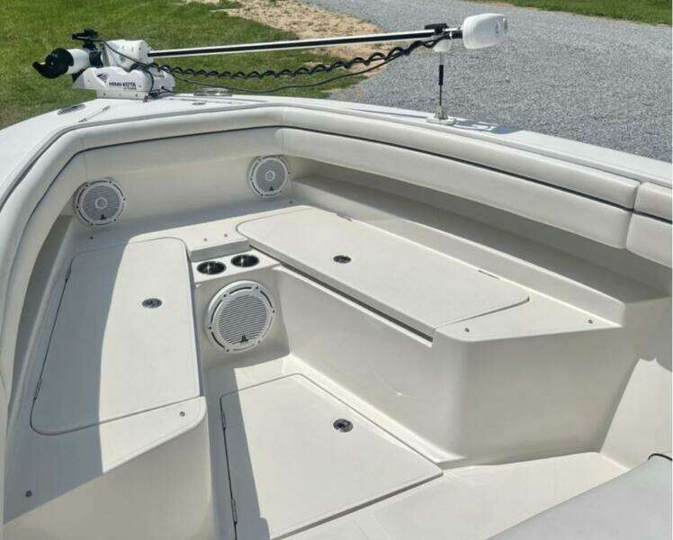 2018 Jupiter 26 FS boat interior with seating, speakers, and storage compartments.