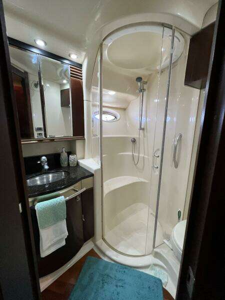 Luxurious bathroom in 2005 Sea Ray 500 Sedan Bridge yacht with modern shower.