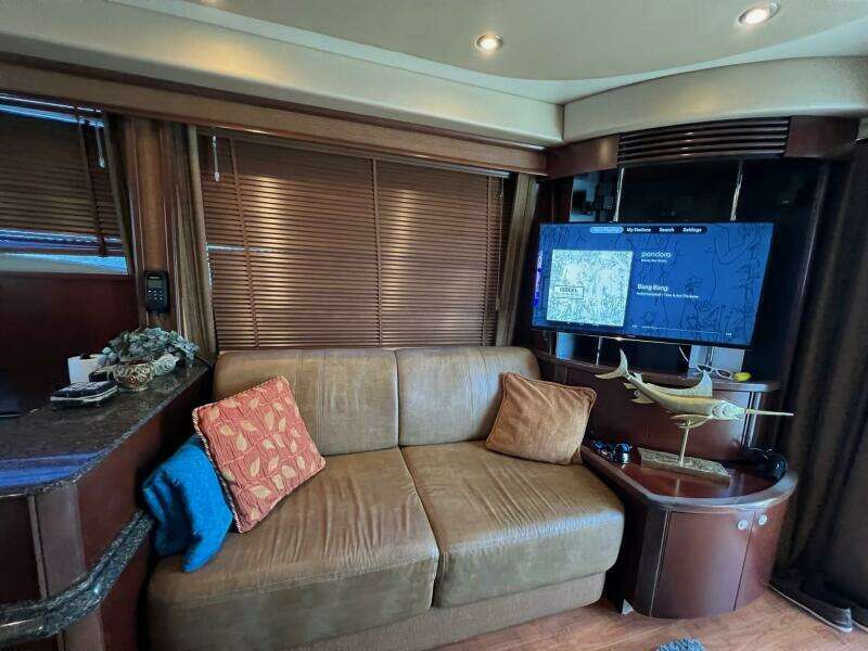 Luxurious interior of 2005 Sea Ray 500 Sedan Bridge with cozy seating and modern amenities.