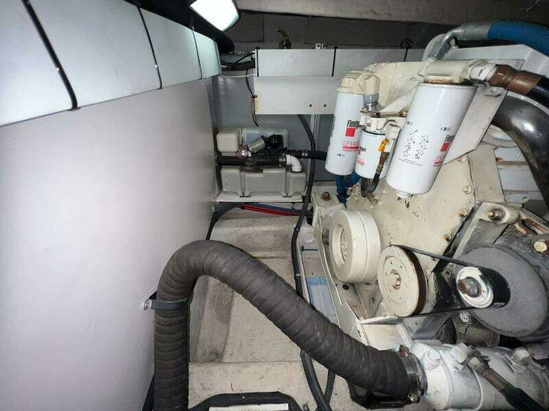 Engine room of a 2005 Sea Ray 500 Sedan Bridge yacht, showcasing mechanical components.