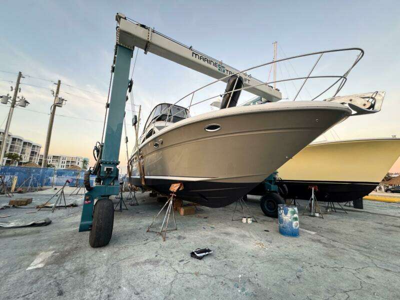 2005 Sea Ray 500 Sedan Bridge yacht on dry dock with crane.