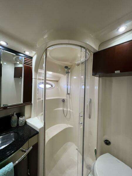 Luxurious bathroom in 2005 Sea Ray 500 Sedan Bridge yacht with modern shower and sleek design.