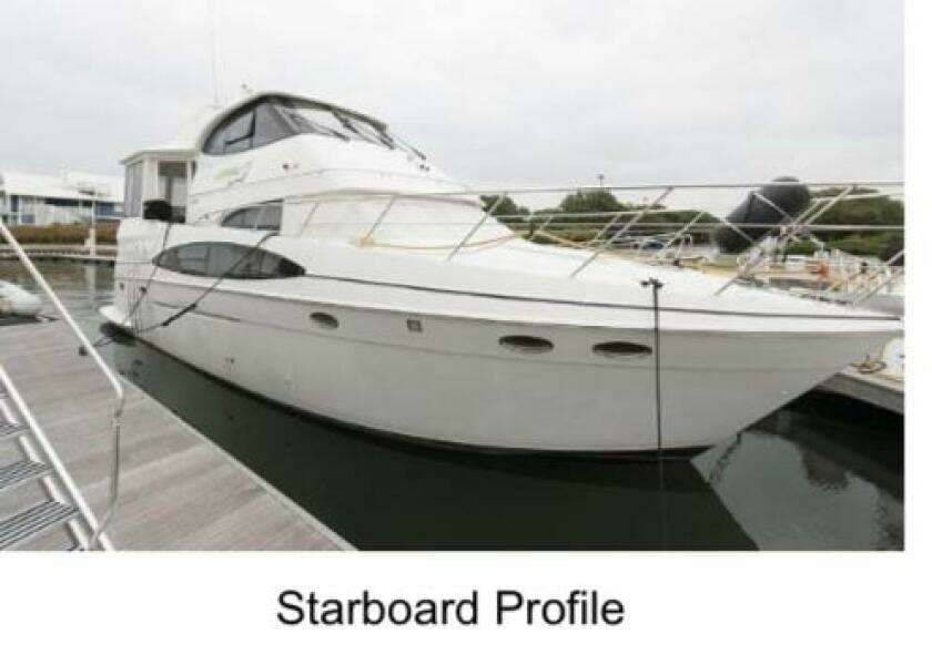2000 Carver 506 Motor Yacht, starboard view, docked in marina.
