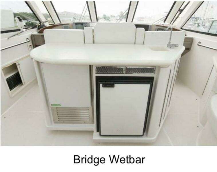 Bridge wet bar on 2000 Carver 506 Motor Yacht, featuring sleek design and modern amenities.
