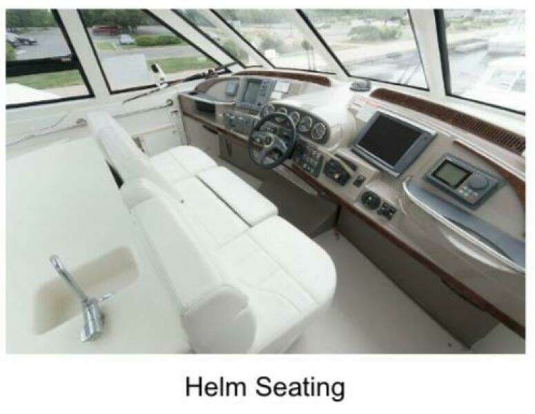 Helm seating area of 2000 Carver 506 Motor Yacht with modern controls and navigation displays.