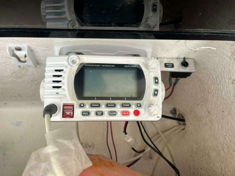 VHF marine radio on 1998 Blue Fin 25 Center Console boat dashboard.