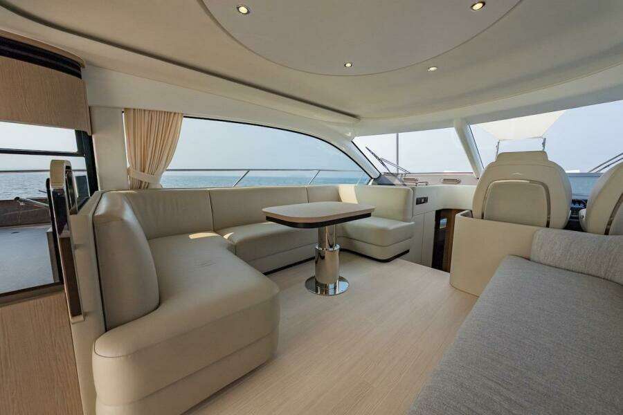 Luxurious interior of 2023 Azimut Fly 53 yacht with elegant seating and ocean view.