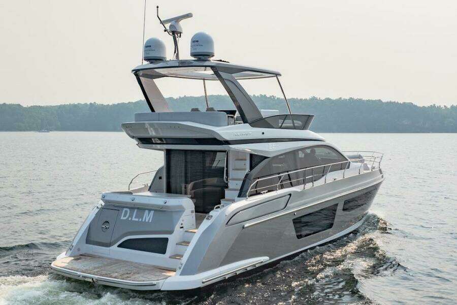 2023 Azimut Fly 53 yacht cruising on a serene lake.