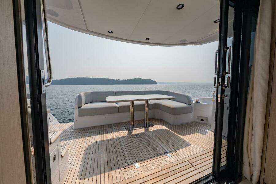 Luxurious 2023 Azimut Fly 53 yacht deck with seating, overlooking serene ocean view.