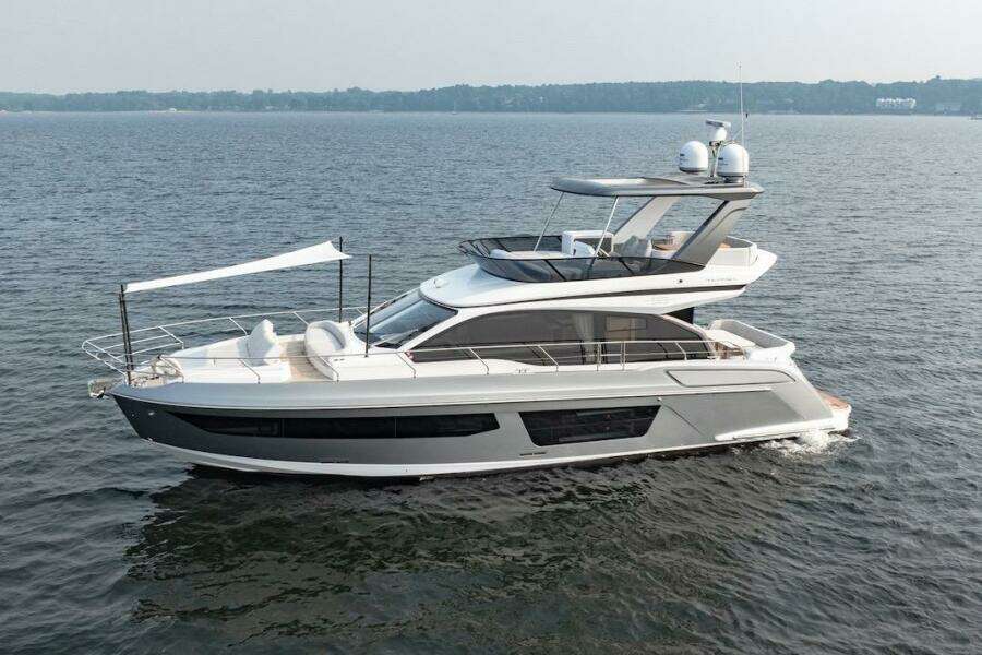 2023 Azimut Fly 53 yacht cruising on open water, showcasing sleek design and luxury features.