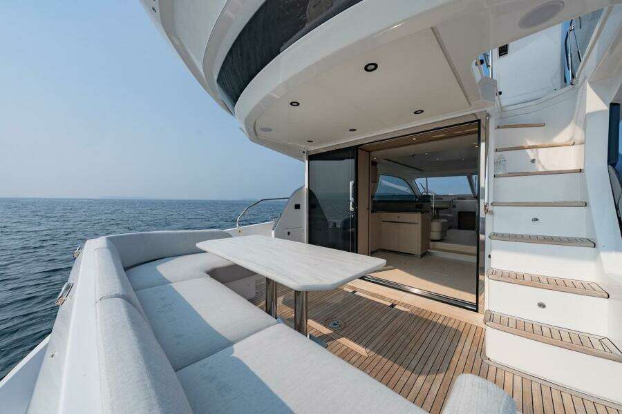 Luxurious 2023 Azimut Fly 53 yacht with elegant deck seating and ocean view.