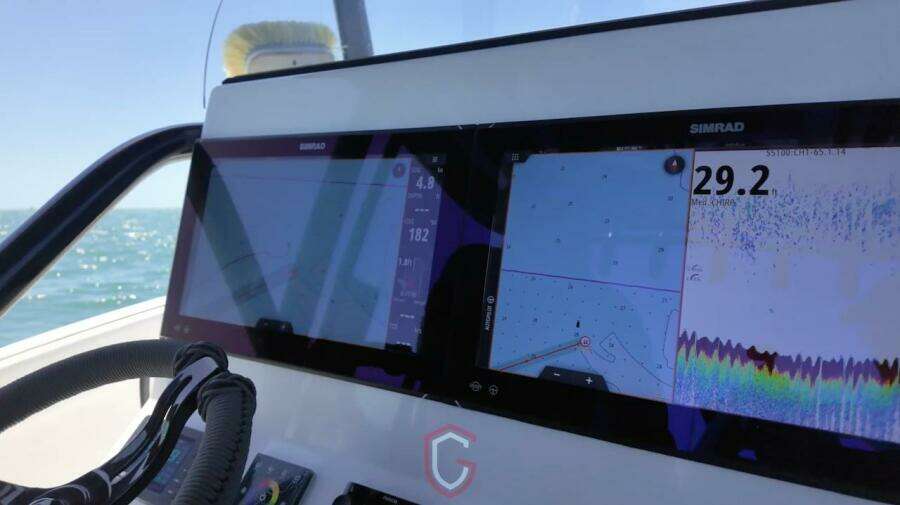 2023 CG Boat Works 35 M-Series dashboard with Simrad navigation displays.