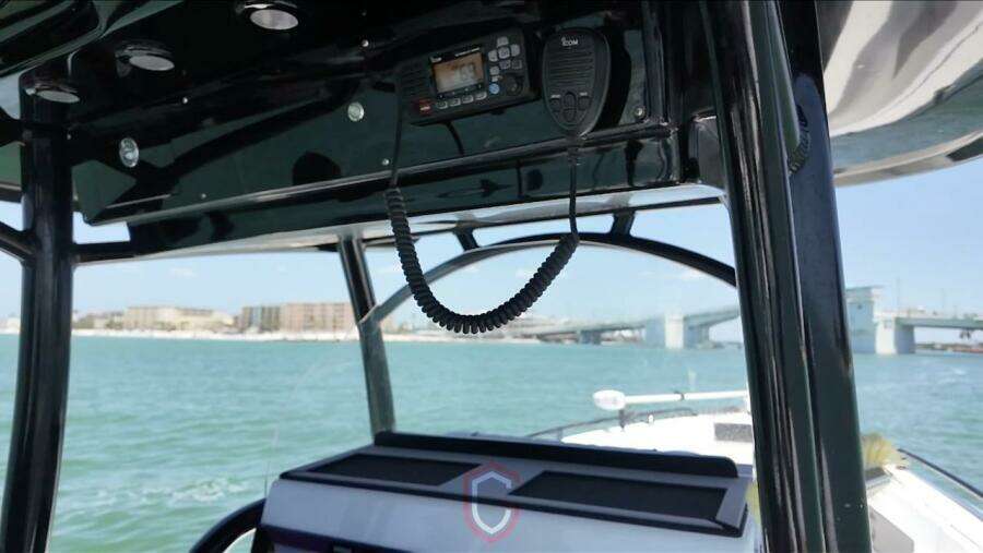 2023 CG Boat Works 35 M-Series interior with radio, overlooking water and bridge.