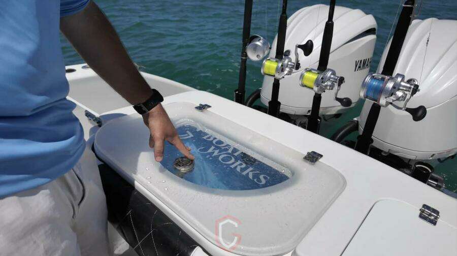 2023 CG Boat Works 35 M-Series with fishing rods and Yamaha engines on water.