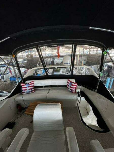 Interior view of 2004 Carver 360 Sport Sedan with seating and striped cushions.