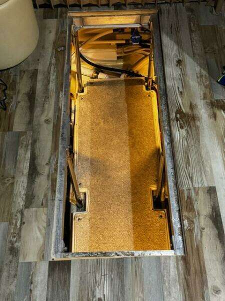 2004 Carver 360 Sport Sedan interior compartment with wooden flooring and storage space.