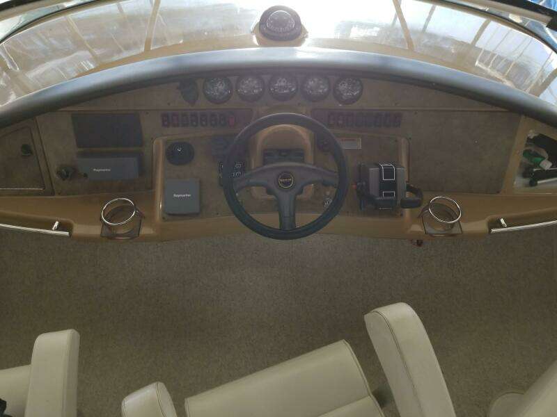 2004 Carver 360 Sport Sedan helm with steering wheel and instrument panel.
