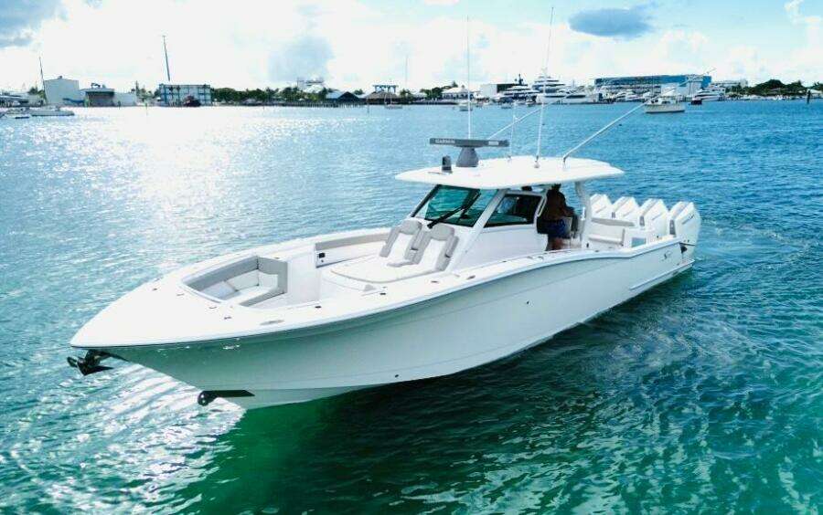 2024 Scout 400 LXF luxury boat cruising on clear blue water.
