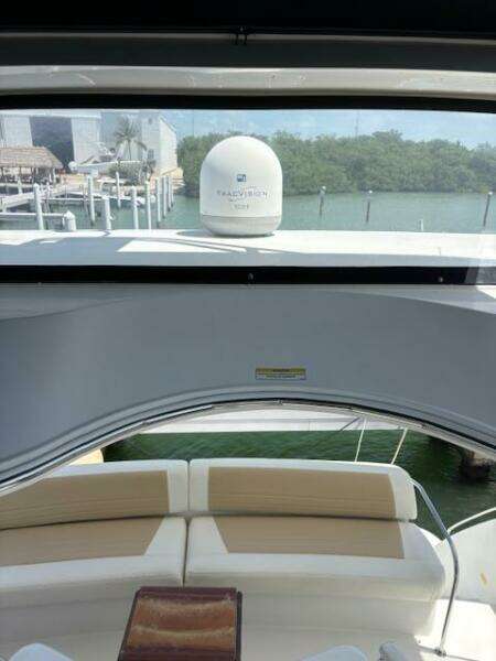 2006 Carver 43 Motor Yacht interior with seating, overlooking marina and water.