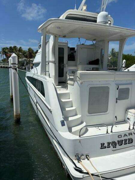 2006 Carver 43 Motor Yacht docked, featuring spacious deck and elegant design.