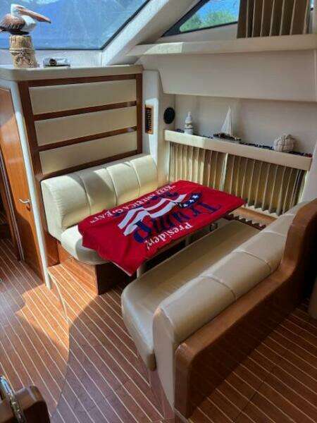 Interior of 2006 Carver 43 Motor Yacht with cozy seating and decorative elements.