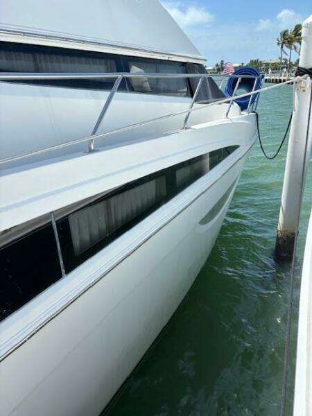 2006 Carver 43 Motor Yacht docked in sunny marina, side view.