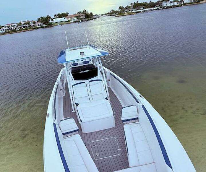 2022 Nor-Tech 390 Sport Center Console boat on calm water, showcasing spacious deck.