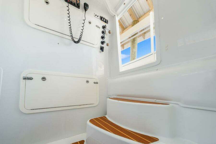 Interior of 2015 Yellowfin 39 boat with steps and control panel.