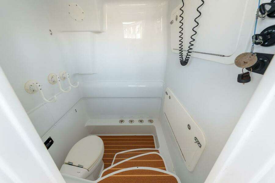 2015 Yellowfin 39 boat interior with toilet and wooden floor accents.
