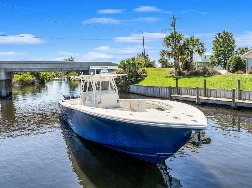 2015 Yellowfin 39 boat on a scenic canal with blue skies.