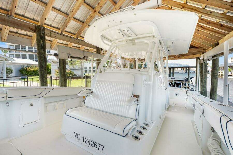 2015 Yellowfin 39 boat interior under a wooden dock canopy.