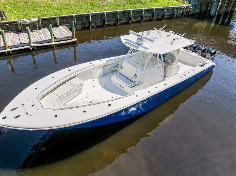 2015 Yellowfin 39 boat docked on calm water, featuring sleek design and spacious deck.