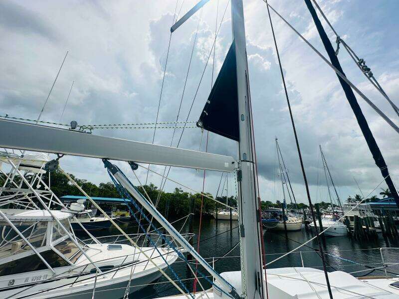 Beneteau Oceanis 45 sailboat docked at marina, cloudy sky, 2015 model.