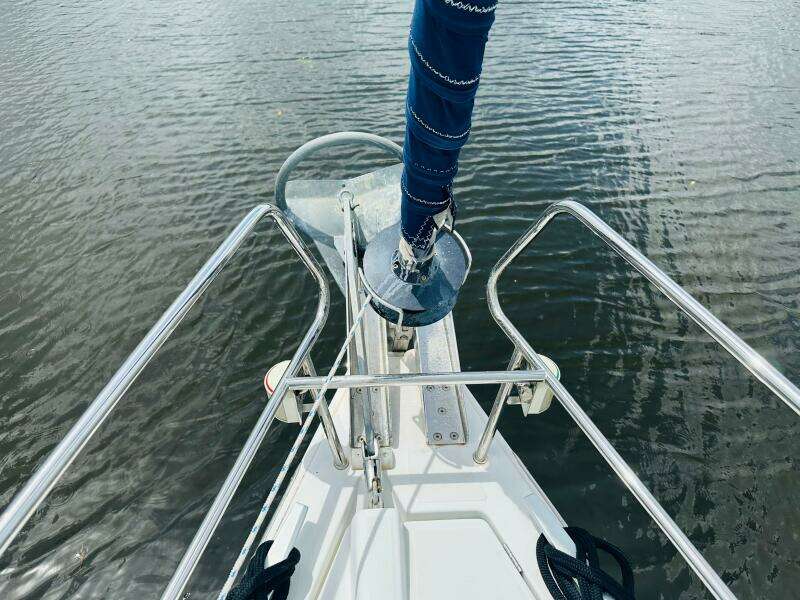Bow view of 2015 Beneteau Oceanis 45 sailboat with anchor and railing.