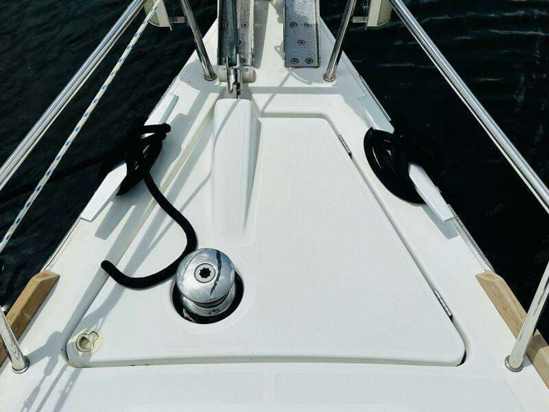 Bow of 2015 Beneteau Oceanis 45 sailboat with winch and ropes.