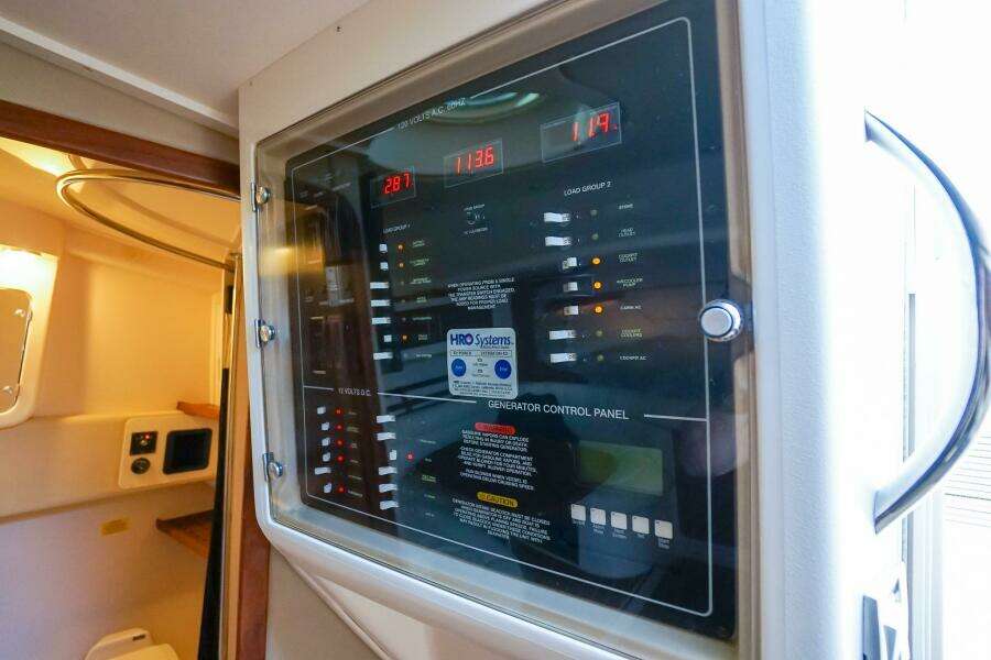 Control panel inside 2007 Grady-White Express 360 boat, featuring various switches and indicators.