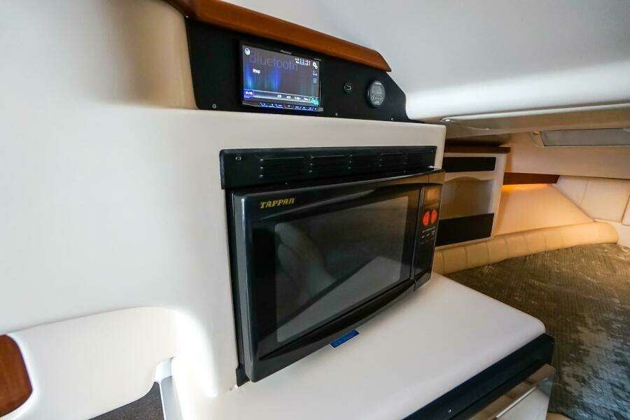 2007 Grady-White Express 360 interior with microwave and control panel.