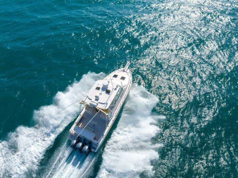 2007 Grady-White Express 360 cruising on open water, aerial view.