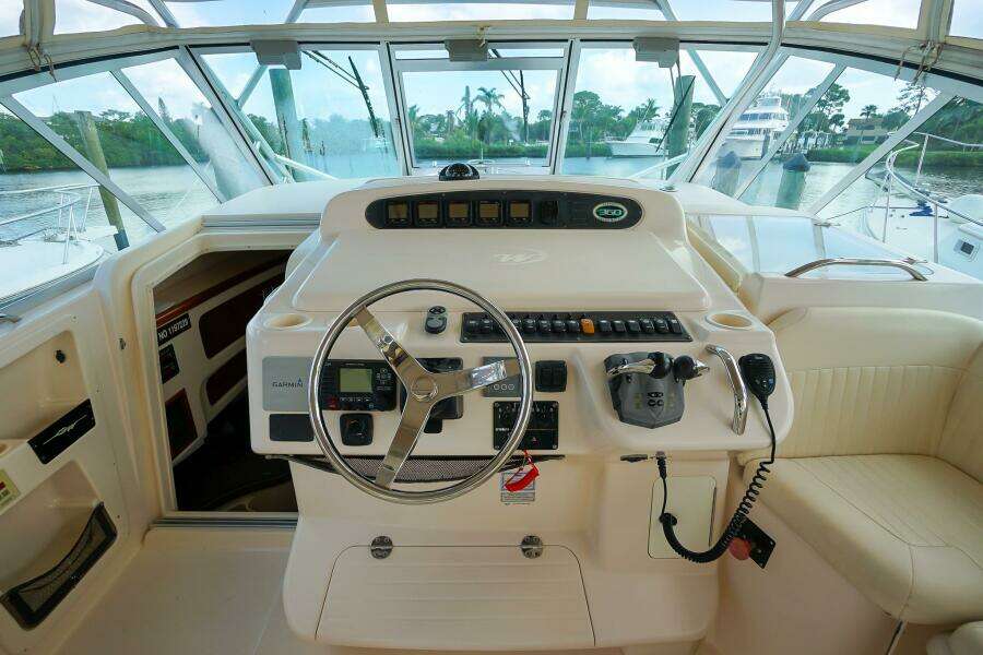 2007 Grady-White Express 360 helm with steering wheel and control panel.