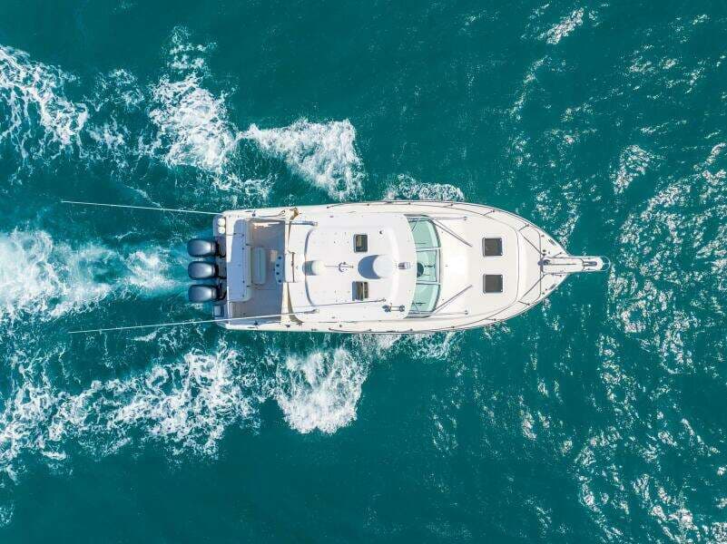 Aerial view of 2007 Grady-White Express 360 boat cruising on blue ocean waters.