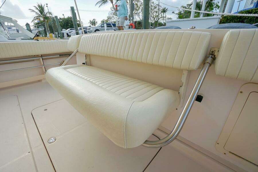 2007 Grady-White Express 360 boat with white cushioned seating in the deck area.