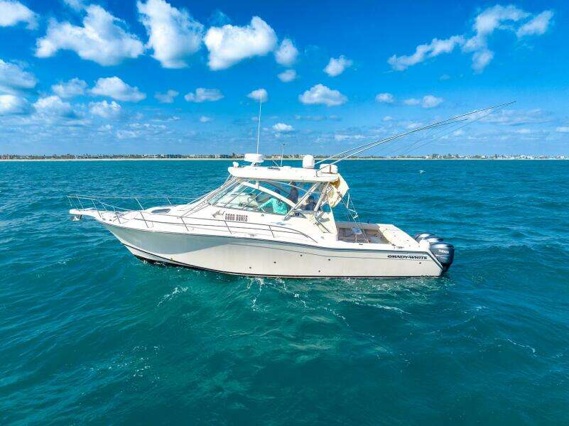 2007 Grady-White Express 360 boat on open sea under blue sky.