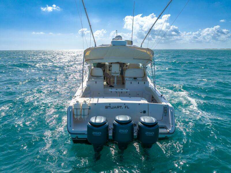 2007 Grady-White Express 360 boat on open sea, featuring triple 250 horsepower engines.