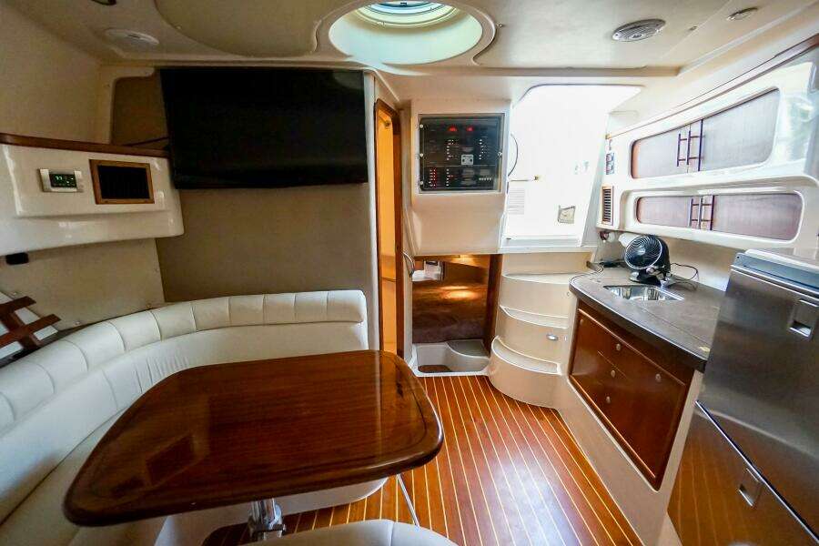 Luxurious 2007 Grady-White Express 360 yacht interior with wood flooring and modern amenities.